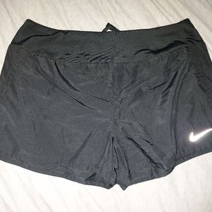 Black Nike running shorts